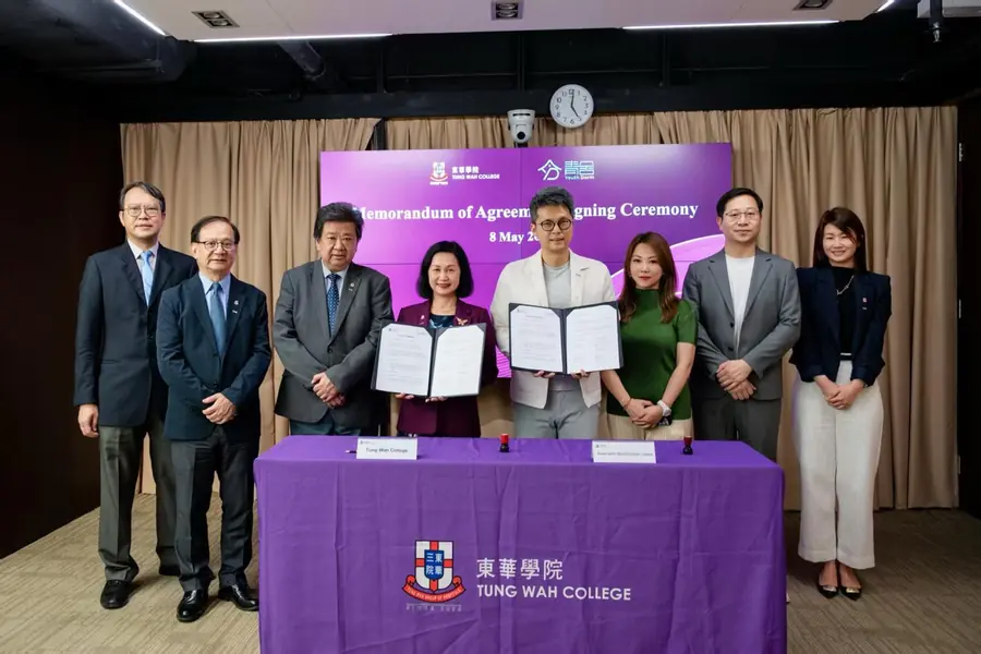 Tung Wah College and Youth Dorm representatives hold the signed Memorandum of Agreement folders with attendees at the signing ceremony, 8 May 2026